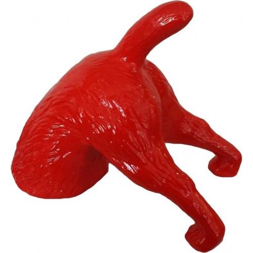Red digging terrier dog statue