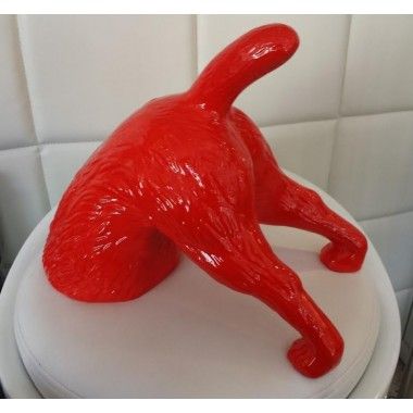 Red digging terrier dog statue